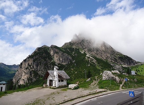 The chapel dwarfed by the mountain
